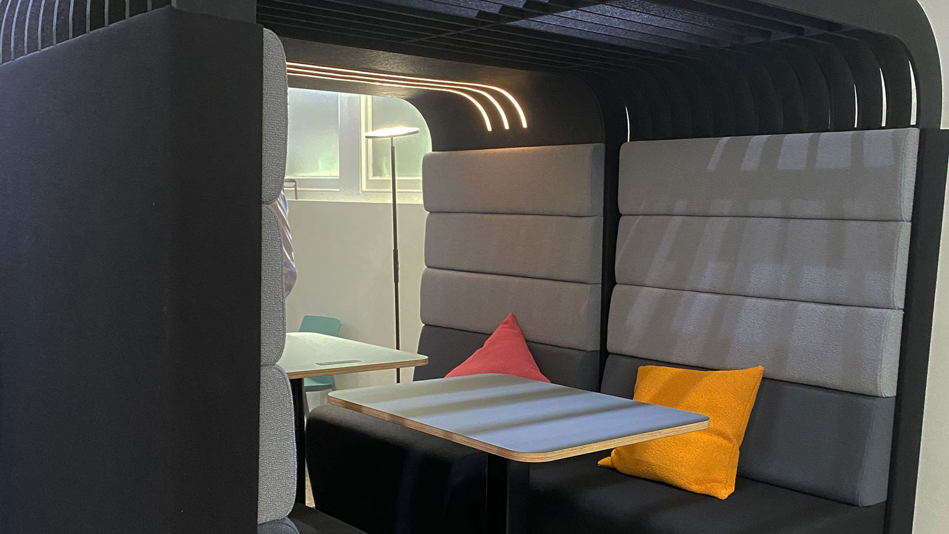 Enclosed Office Pod with Tables and Padded Seating